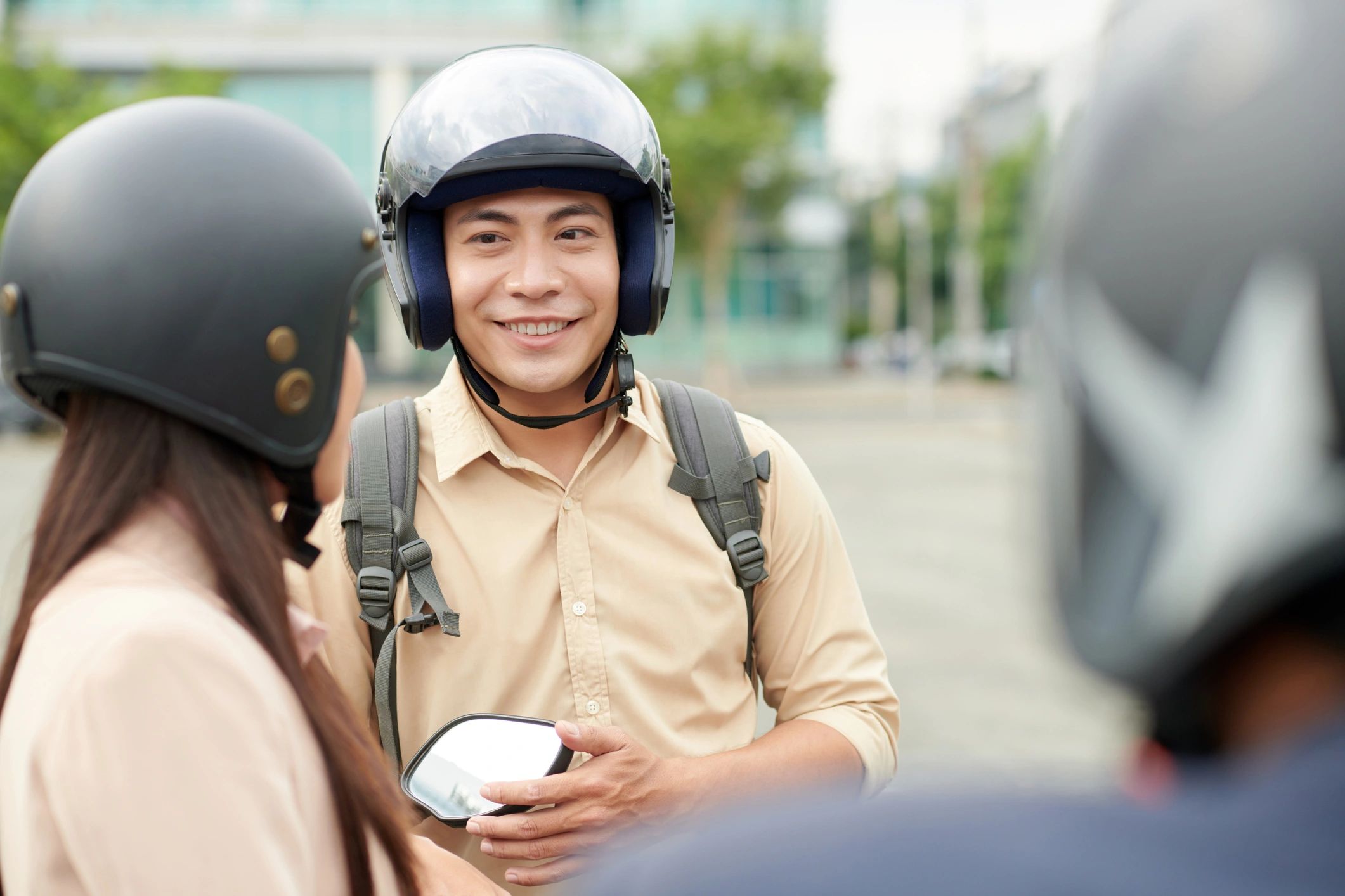 Motorcycle rider talking with friends during a meetup
