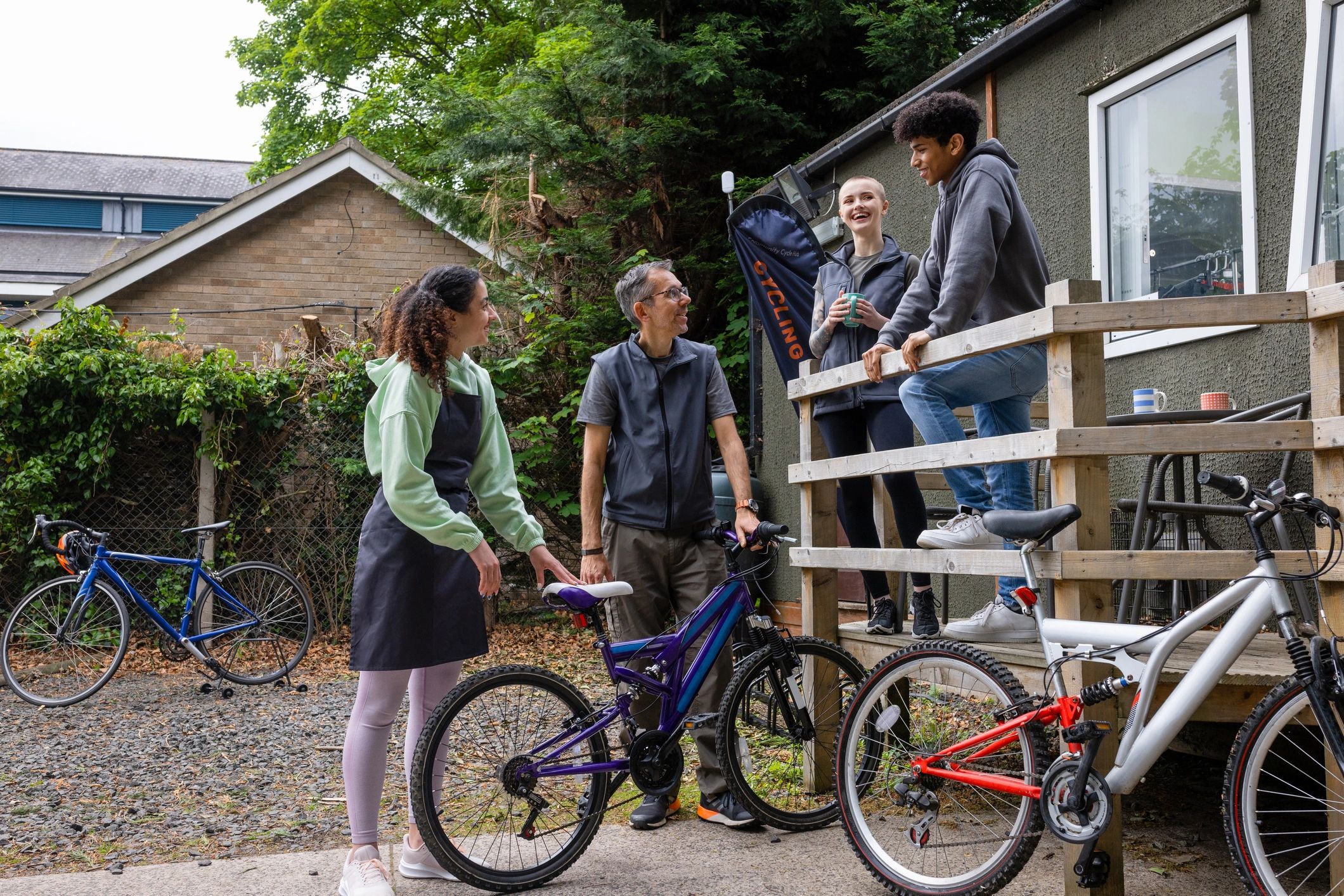 Group of riders and friends gathered together outdoors